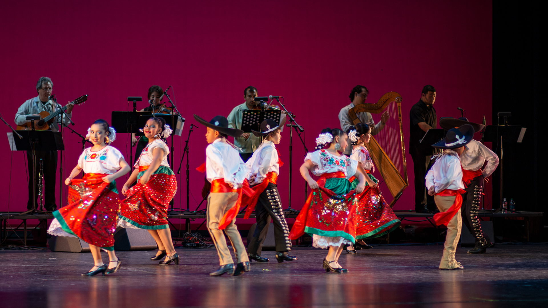 The children's group doing a turn during the Mexican hat dance