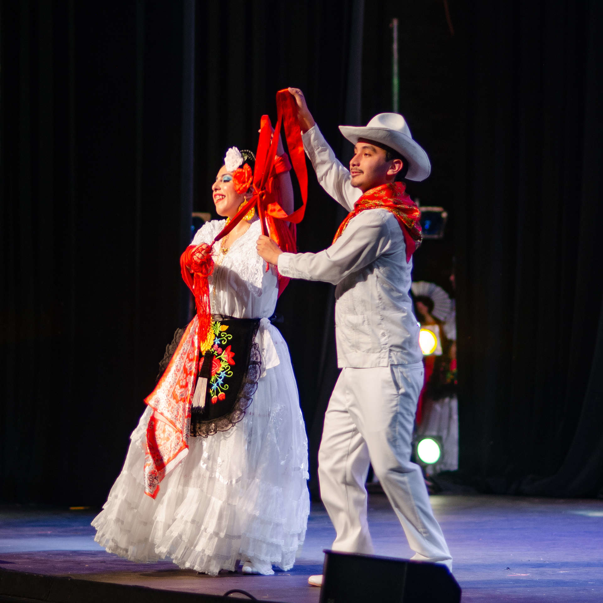 A finished bow made by two dancers with their feet during the famous dance La Bamba
