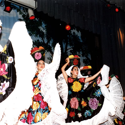 Women dressed like tehuanas performing a dance from the Guelaguetza, a famous fiesta in the state of Oaxaca